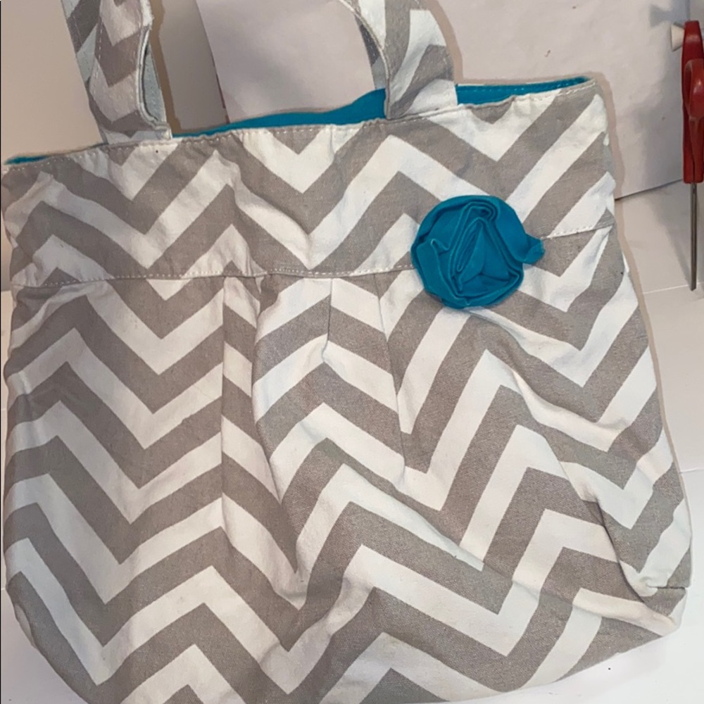 Cloth chevron bag with accent blue flower